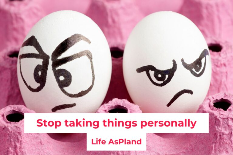 Two egg shells with grumpy faces painted on them.