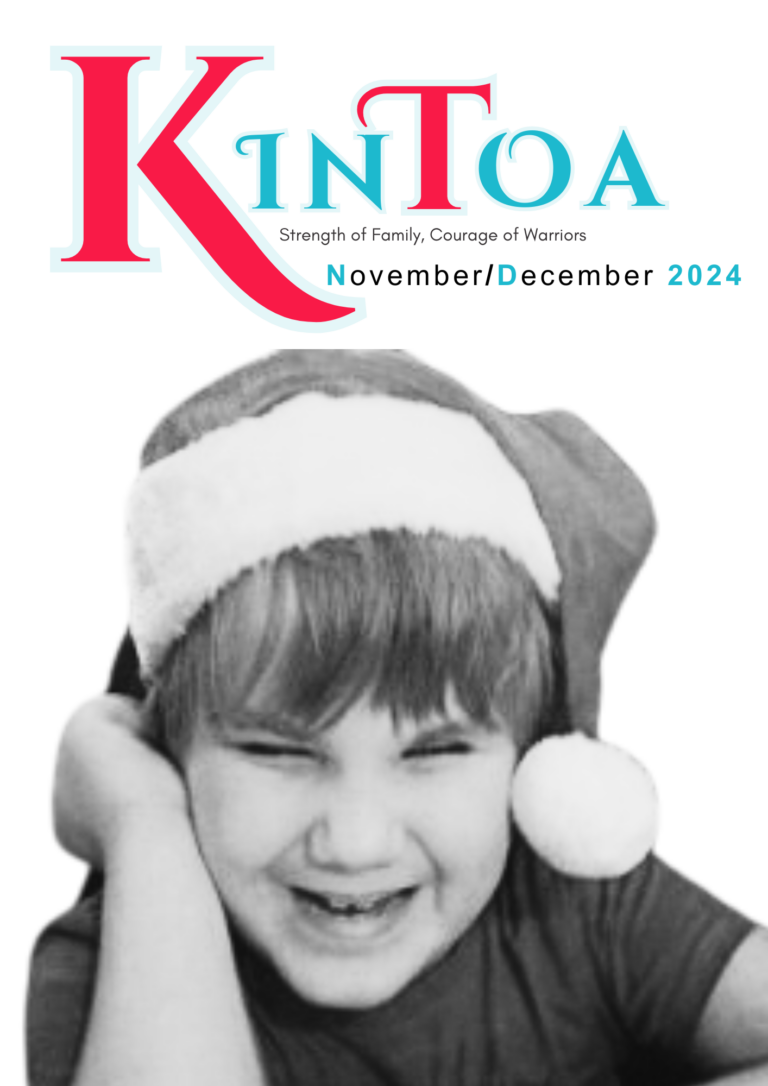 Cover of KinToa's November 24 edition. Young boy wearing a santa hat is sat with a big smile on his face.